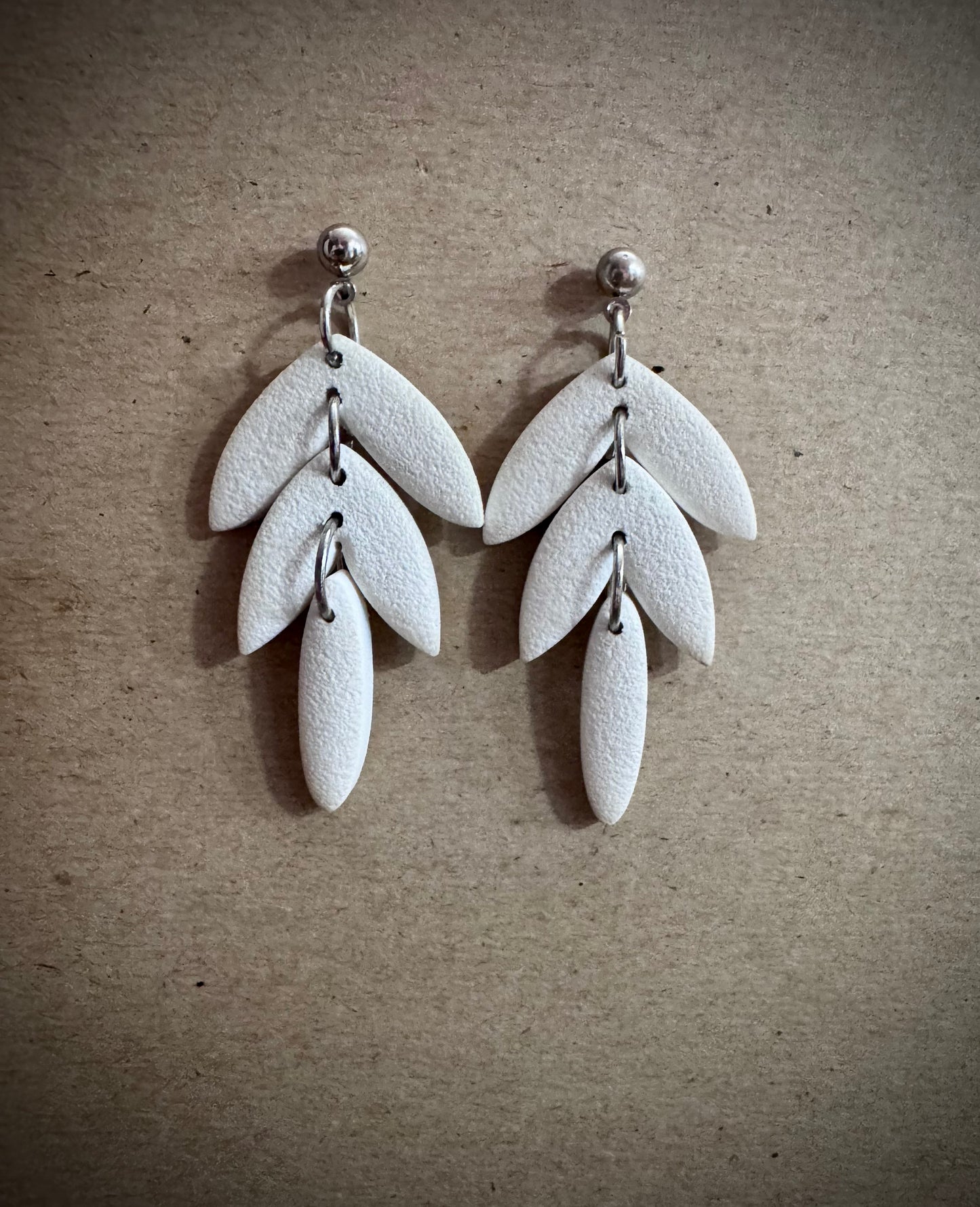 White tiered dangle earring